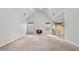 Open living room features vaulted ceilings, a fireplace, and seamless flow into the adjacent eat-in kitchen at 2275 Perch Sw Way, Marietta, GA 30008