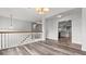 Bright open-concept living area featuring wood flooring and staircase at 2275 Perch Sw Way, Marietta, GA 30008