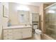 Bright bathroom with a vanity, toilet, and shower featuring glass doors at 300 Johnson Ferry Ne Rd # B401, Atlanta, GA 30328