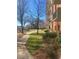 Beautifully landscaped exterior with walking paths, mature trees, and well-maintained lawn at 300 Johnson Ferry Ne Rd # B401, Atlanta, GA 30328