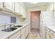 Kitchen featuring white appliances, light countertops, and cabinets at 300 Johnson Ferry Ne Rd # B401, Atlanta, GA 30328