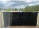 Private patio with privacy screen and view of the surrounding landscape at 300 Johnson Ferry Ne Rd # B401, Atlanta, GA 30328