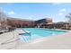 A large, sparkling outdoor pool surrounded by lounge chairs and a nearby gazebo for relaxation at 300 Johnson Ferry Ne Rd # B401, Atlanta, GA 30328