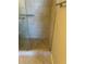 Walk-in shower with tiled walls and floor, featuring glass door and grab bar at 300 Johnson Ferry Ne Rd # B401, Atlanta, GA 30328