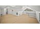 Finished attic space featuring carpet, storage, small window and air conditioning unit at 1903 Olde Village Run, Dunwoody, GA 30338