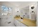 Bathroom with a built in tub, vanity and large window at 1903 Olde Village Run, Dunwoody, GA 30338
