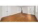 Bedroom showcasing hardwood floors and multiple doors including a bathroom at 1903 Olde Village Run, Dunwoody, GA 30338
