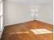 Bright bedroom featuring hardwood floors and a large window for natural light at 1903 Olde Village Run, Dunwoody, GA 30338