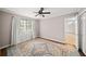 Bedroom features a window with sheer curtains and a decorative rug at 1903 Olde Village Run, Dunwoody, GA 30338