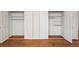 Spacious bedroom closet featuring shelves, rods, and doors with white trim at 1903 Olde Village Run, Dunwoody, GA 30338