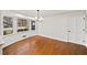 Dining room with hardwood floors, bright windows, and wainscoting at 1903 Olde Village Run, Dunwoody, GA 30338