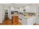 Bright kitchen with granite countertops, wooden island and modern appliances at 1903 Olde Village Run, Dunwoody, GA 30338