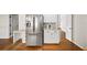 Kitchen with stainless steel refrigerator, granite countertops, and ample cabinet space at 1903 Olde Village Run, Dunwoody, GA 30338