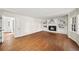 Spacious living room with hardwood floors, fireplace and built-in shelving at 1903 Olde Village Run, Dunwoody, GA 30338