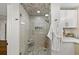 Bathroom showcasing a glass shower, marble tile, and modern fixtures at 1903 Olde Village Run, Dunwoody, GA 30338