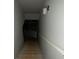 Stairs leading to an unfinished basement with lighting fixture at 5021 Falcon Pt, Douglasville, GA 30135