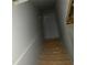 Basement stairway view with unfinished wooden steps at 5021 Falcon Pt, Douglasville, GA 30135