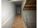 Stairway to basement shows unfinished steps leading to a closed door at 5021 Falcon Pt, Douglasville, GA 30135