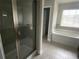 Primary bathroom featuring a shower with glass door, soaking tub, and dark wood vanity at 5021 Falcon Pt, Douglasville, GA 30135