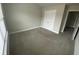 Bedroom features neutral colored walls and carpet, a double door closet, and natural light at 5021 Falcon Pt, Douglasville, GA 30135