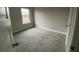 Bedroom with light walls, carpeted floors and bright window at 5021 Falcon Pt, Douglasville, GA 30135