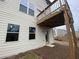 Exterior view of home showing a small, elevated deck and backyard access at 5021 Falcon Pt, Douglasville, GA 30135