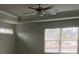 A Primary bedroom features trey ceilings, a ceiling fan, and bright windows at 5021 Falcon Pt, Douglasville, GA 30135