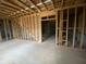 Unfinished basement with studded walls, wiring and utilities exposed above at 5021 Falcon Pt, Douglasville, GA 30135