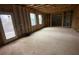 Unfinished basement space with a door to outside, studded walls and windows at 5021 Falcon Pt, Douglasville, GA 30135