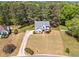 Spacious property featuring a two-story home with a long driveway and expansive lawn at 4265 Elmhurst Ln, Cumming, GA 30028