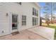 View of the home's back patio, door to the interior, and an array of windows at 4265 Elmhurst Ln, Cumming, GA 30028