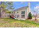 A nice large backyard featuring a slide, a back door, and a large window with a view at 4265 Elmhurst Ln, Cumming, GA 30028