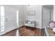 Welcoming entryway with hardwood floors, a decorative bench, and neutral wall color at 4265 Elmhurst Ln, Cumming, GA 30028