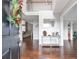 Grand foyer with hardwood floors, a console table, and a view of the upper level at 4265 Elmhurst Ln, Cumming, GA 30028