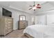 Cozy main bedroom featuring a ceiling fan and a light and airy color palette at 4265 Elmhurst Ln, Cumming, GA 30028