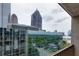 Balcony view showing the city's skyline and modern buildings at 145 15Th Ne St # 1012, Atlanta, GA 30309
