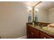 Bathroom features a granite countertop and a large mirror, offering a functional and stylish space at 145 15Th Ne St # 1012, Atlanta, GA 30309