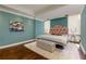 A bright bedroom featuring hardwood floors, a decorative headboard, and ample natural light at 145 15Th Ne St # 1012, Atlanta, GA 30309