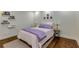 Well-lit bedroom with hardwood floors, side tables, and charming wall decor at 145 15Th Ne St # 1012, Atlanta, GA 30309