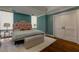 Bright bedroom with a patterned headboard, hardwood floors, and generous natural light; cozy and stylish at 145 15Th Ne St # 1012, Atlanta, GA 30309