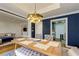 Bright dining room with a modern chandelier, stylish table setting, and view of the living room at 145 15Th Ne St # 1012, Atlanta, GA 30309