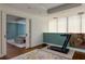 Bright fitness area featuring a treadmill and an open doorway to a bedroom with blue walls at 145 15Th Ne St # 1012, Atlanta, GA 30309