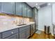 Charming kitchen displays gray cabinets, stainless steel appliances, and granite counters at 145 15Th Ne St # 1012, Atlanta, GA 30309