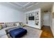 Comfortable living room with a large sofa, built-in shelving, and a cozy atmosphere at 145 15Th Ne St # 1012, Atlanta, GA 30309