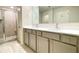Bathroom with a double sink vanity and a glass shower at 353 Vista Ln, Woodstock, GA 30189