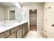 Double sink vanity, and tiled floors, adjacent to a walk-in closet at 353 Vista Ln, Woodstock, GA 30189