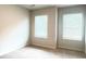 Bedroom with neutral carpet and walls features two windows allowing plenty of light at 353 Vista Ln, Woodstock, GA 30189