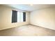 Bedroom with carpet floors and a window with black curtains at 353 Vista Ln, Woodstock, GA 30189