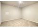 Bright, carpeted room with neutral walls, ready for personalization, offering a flexible living space at 353 Vista Ln, Woodstock, GA 30189