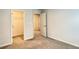Bedroom with carpet and adjacent walk-in closet, offering storage and organization solutions at 353 Vista Ln, Woodstock, GA 30189